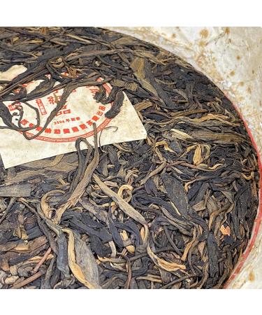 Pu-erh Tea 2006 Xishuangbanna Yiwuzhengshan Wild Big Leaf Green Cake 380g Raw - Buy Online on GoSupps.com