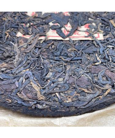 Pu-erh tea late 80s Ying Min Yuannian Qizi Cake Tea 357g Raw - Buy Online on GoSupps.com