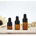 24 Mini Amber Glass Essential Oil Drip Bottles with Black Rubber Caps - Perfect for Cosmetics Perfume & Sample Liquid Storage (1ml) - Buy Online on GoSupps.com