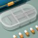 Small Pill Box with 4 Compartments - Waterproof Travel Daily Pill Organizer | Compact Medicine Holder for Vitamins - Blue & White - Buy Online on GoSupps.com