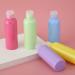 TOUREAL 100ML Travel Bottle Set (5 pcs) - Empty Cosmetic Filling Bottles with Funnel - Multi-Colored Flip Cap Donor Containers for International Shipping - Buy Online on GoSupps.com