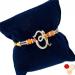 Ghasitaram Gifts Rakhi for Brother Rakhis Online - 7161 OM Viganhartha Diamond Rakhi