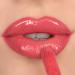 Revolution Pout Bomb Plumping Gloss - Peachy Coral 1 Piece | International Shipping Available - Buy Online on GoSupps.com