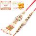 Ghasitaram Gifts Rakhis Online - Rakhi for Brother- Shimmering Blessings cl6101 Bhaiya Bhabhi Rakhi with 200 GMS of Besan Barfi and 200 GMS of Kaju Katli