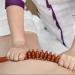 Wooden Massage Roller with Handle - Anti-Cellulite Body Massager for Back Neck & Legs - 12 Wheels - Natural Color - Buy Online on GoSupps.com