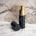8ml Perfume Travel Atomizer by The Essential Atomizer Company. Black with Silver Dot Design. Filling Funnel & Gift Box - Buy Online on GoSupps.com