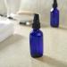 2oz Glass Spray Bottles for Essential Oils - Set of 12 Blue Bottles with Black Mist Tops - Buy Online on GoSupps.com