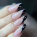 Justotry 24 pieces of gold glitter stiletto nails to stick on short black French press on nails pretty swirl almond art nail fake nails medium fingernails artificial nails for women black & glitter 2