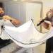 White Shaving Bib with Suction Cups - Salon Care Smock for Men's Grooming - Hair Cutting Apron with Powder Puff - Buy Online on GoSupps.com