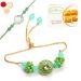 Ghasitaram Gifts Rakhis Online - Rakhi for Brother-T-12 Green Stone Bhaiya Bhabhi Rakhi with 200 GMS of Besan Barfi Rakhi Set with 200 gms of Besan Barfi