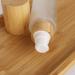 Cosidea 100ml Refillable Bamboo Lid Glass Bottles | Lotion Pump & Travel Containers for Cosmetics - Buy Online on GoSupps.com