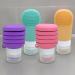 Mijoma 4-Part Travel Set | Leak-Proof Foldable Silicone Bottles for Shampoos & Liquids | Colorful Hand Luggage with Suction Cup & Brush - Buy Online on GoSupps.com