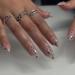 MISUD Press on Nails - Medium Almond Glossy Chrome Swirl Acrylic Stiletto - 24 pcs 3D Pearl Flash False Nails for Stunning Nail Art - Buy Online on GoSupps.com