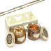 Ghasitaram Gifts Rakhi Gifts for Brothers White Wooden Tray of 2 Jars of Dryfruit Halwa and Almonds with 2 Green Beads Rakhis Tray of 2 Jars Dryfruit Halwa Almonds with 2 Rakhi