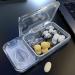 Portable 2-in-1 Pill Organizer & Cutter - BPA Free Small Pill Box for Medicine & Supplements (Black - Buy Online on GoSupps.com