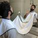 White Shaving Bib with Suction Cups - Salon Care Smock for Men's Grooming - Hair Cutting Apron with Powder Puff - Buy Online on GoSupps.com