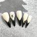 Shop Gothic Halloween Press-On Nails | Medium Almond Black French Tip Design - 24pcs Acrylic Stick-On Witch Nails for Women & Girls - Buy Online on GoSupps.com