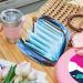 Shop Multicolored Storage Bags for Women's Essentials - Bandages Tampons & More | Portable Bags with Sunset & Beach Waves Design - Buy Online on GoSupps.com