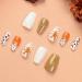 DMQ Coffin Christmas False Nails - Gold Glitter Fake Nails with Festive Patterns | Press on Nail Set with Glue for Women and Girls - Buy Online on GoSupps.com