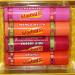 Lip Smackers 4pc Holiday Lip Balm Tin Set - Starburst Flavors: Strawberry Cherry Kiwi Mango Melon Orange - International Shipping Available - Buy Online on GoSupps.com
