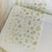 Alien Nail Art Stickers - 3D Planet Astronaut Earth Moon Star UFO Rocket Decals | Gold Luminous Self-Adhesive Designs for Women's DIY Manicures - Buy Online on GoSupps.com