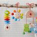 HABA 305230 Han Parrot Figure | Baby Toys for Seats Cots & Strollers | Wooden Toys with Bells for 6+ Months - Buy Online on GoSupps.com