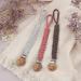 Shop LUVADEYO Hand-Woven Cotton Pacifier Chain | Modern Baby Accessories | White Khaki & Powder Colors for Stylish Parenting - Buy Online on GoSupps.com
