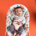 Bright Starts Playful Pinwheels Portable Baby Bouncer with Vibrating Seat and Toy Bar - 19.8x13.1x3.4 Inch - Ages 0-6 Months - Buy Online on GoSupps.com