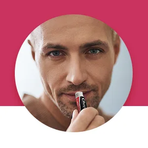 Chapstick Lip Care Skin Protectant Classic Cherry 3 Sticks 0.15 oz (4 g) Each - handsome man using chapstick cherry flavored lip balm