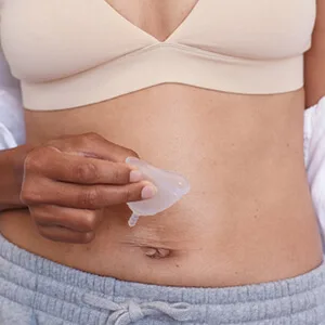 AllMatters Menstrual Cup (Formerly OrganiCup) Size A for Those Who Haven t Given Birth Vaginally. Award Winning Period Cup - Model holding AllMatters menstrual cup