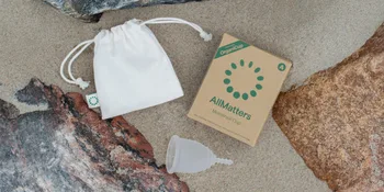 AllMatters Menstrual Cup (Formerly OrganiCup) Size Mini for Teens or Those Who Need a Smaller Size. Award Winning Period Cup - AllMatters menstrual cup product display on sand