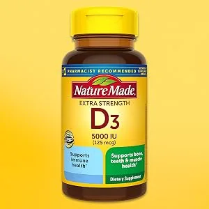 Nature Made D3 Extra Strength 125 mcg 90 Softgels - Nature Made D3 extra strength bottle on yellow background