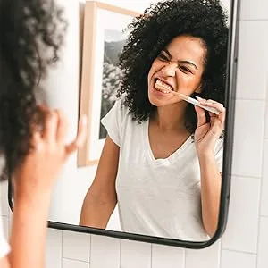 Terra & Co. Brilliant Black Toothpaste Mint 4 oz (113 g) - Woman brushing teeth