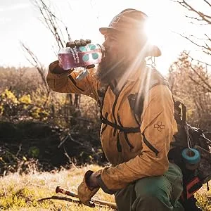 DripDrop ORS Patented Electrolyte Powder -  Variety Pack Watermelon ,Berry, Lemon - 16 Count - Photo: A firefighter drinks a DripDrop on break from fighting an apparent wild fire