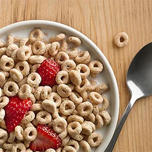 General Mills  Cheerios Oat Cereal - 18 oz - Gluten Free Cheerios breakfast cereal served in a bowl on a table.