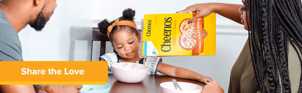 General Mills  Cheerios Oat Cereal - 18 oz - Mother and father enjoy eating Cheerios whole grain cereal with their daughter at the table.