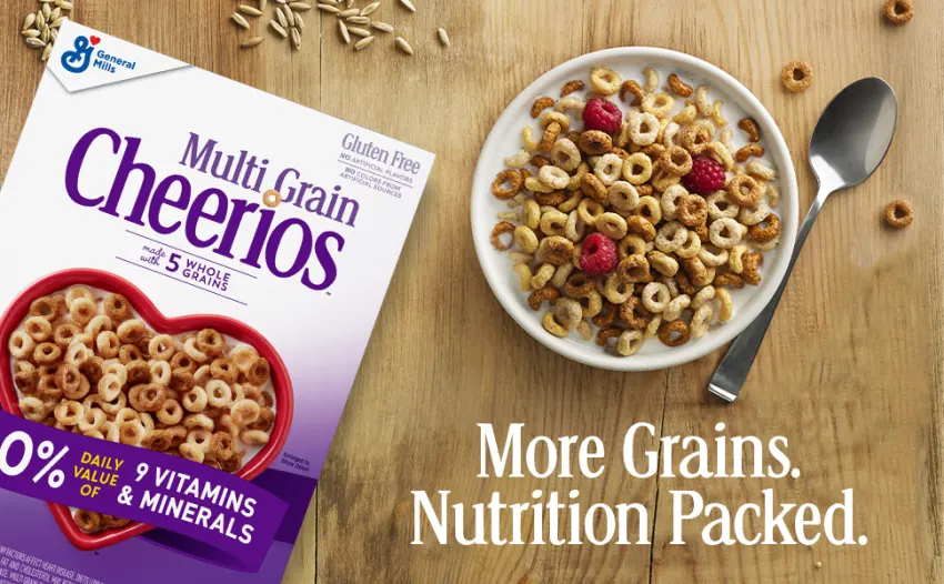 Multi Grain Cheerios Breakfast Cereal Gluten Free Whole Grain Oats - 12 Oz. - Gluten Free Multi Grain Cheerios box and a bowl filled with Cheerios cereal on a table.
