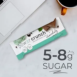 Power Crunch Whey Protein Bars High Protein Snacks with Delicious Taste Red Velvet 1.4 Ounce (12 Count) - 5-8g Sugar with chocolate mint on desk with computer next to it