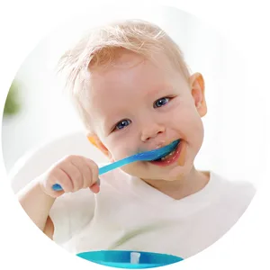Gerber Mashed Potatoes with Meatloaf & Gravy and a side of Carrots Peas and Corn 6.67 oz. 8 Count - Happy baby eating Gerber Entrees with spoon.