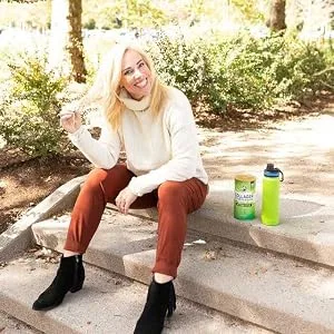 Great Lakes Gelatin Collagen Hydrolysate Unflavored Beef Protein Kosher 16 Oz Can - Drink made with Unflavored Collagen Hydrolysate Powder place next to a woman