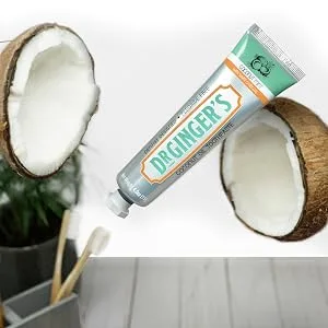 Dr. Ginger's Coconut Oil Toothpaste with White Activated Charcoal, 4 oz, 1 Count - Coconut Mint Flavor 4 Ounce, 1 Count - White Charcoal Toothpaste floating in the air