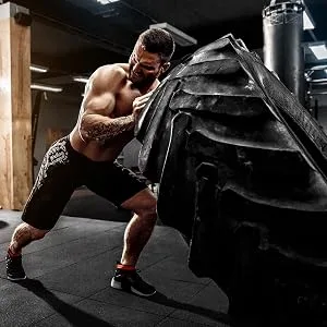 BCAA Amino Acids | 2000mg | 400 BCAA Capsules | Non-GMO, Gluten Free Branch Chain Amino Acids Supplements | by Carlyle - Man lifting tire