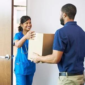 McKesson Non-Adherent Dressing Pads, Sterile, Nylon/Polyester, 3 in x 4 in, 100 Count, 1 Pack 3x4 Inch (Pack of 100) - Delivery man giving a box of McKesson products to a nurse