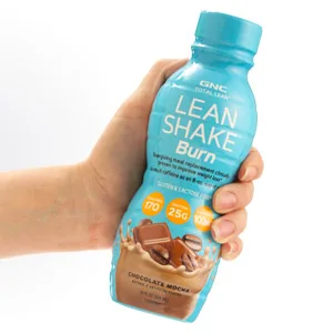GNC Total Lean | Lean Shake Burn, Protein Powder | Hunger Satisfying, High Protein Blend, Proven to Burn 3X More Calories | Vanilla | 16 Servings - Lean Shake Burn product being held in hand