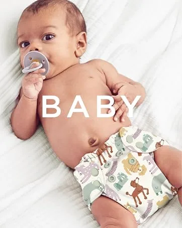 Esembly Wipe Up Wash Kit Organic No-Rinse Foaming Wipes Solution Use with Cloth Wipes on Baby s Diaper Area or as a Body Wash Includes Refillable Foamer Bottle and 4oz Concentrate - Baby wearing an Esembly cloth diaper with the word