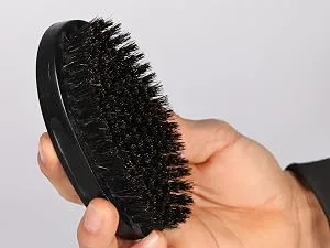 Silver Fox Complete Men's Grooming Collection - man holding beard brush