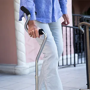 StrongArm Comfort Cane + Self Standing Lightweight Adjustable Walking Cane + Stabilizes Wrist & Provides Extra Support & Stability + Ergonomic Forearm Grip + Canes for Men & Women + FSA/HSA Eligible Black - walking down stairs with StrongArm Cane