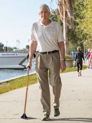 StrongArm Comfort Cane + Self Standing Lightweight Adjustable Walking Cane + Stabilizes Wrist & Provides Extra Support & Stability + Ergonomic Forearm Grip + Canes for Men & Women + FSA/HSA Eligible Black - Walking with StrongArm Comfort Cane
