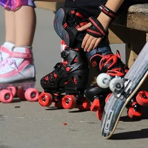 Roller Derby Track Star Adjustable Roller Skates for Beginners, Boys & Girls Black/Red Large (3-6) - Trac Star outdoors at the skate park