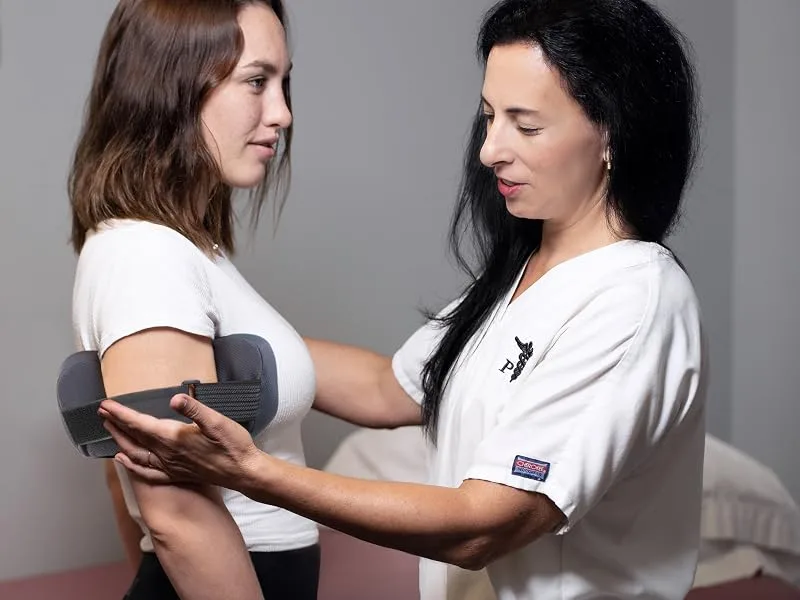 OPTP PRO Shoulder Support Shoulder Pillow for Rotator Cuff Pain Use During Recovery Following Surgery and Post Shoulder Sling - Post-Athletic Recovery Tool - Large/Extra Large - PRO Shoulder Support - Overhead athlete using for shoulder and rotator cuff pain relief recovery
